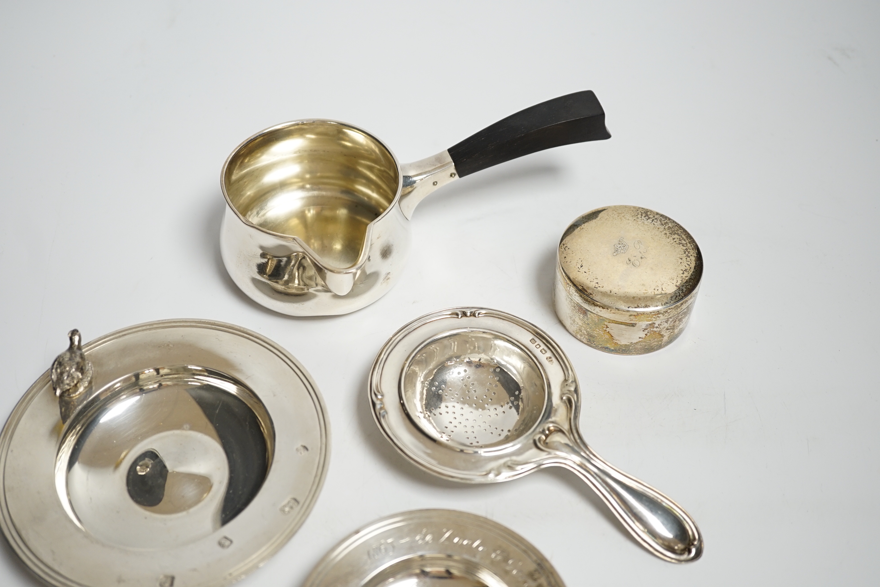 Two small modern silver dishes, a silver tea strainer and two Scandinavian items.